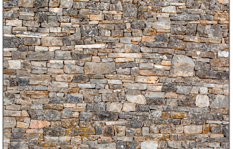 Natural stone wall backdrop with textured stone design from Dramatic Dimensions Entertainment in Garden City, Metro Detroit, and Southeast Michigan