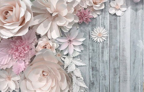 Rustic wood photo booth backdrop with pink flowers, a favorite choice for photo booth rentals near me from Dramatic Dimensions Entertainment serving Garden City, Metro Detroit, and Southeast Michigan