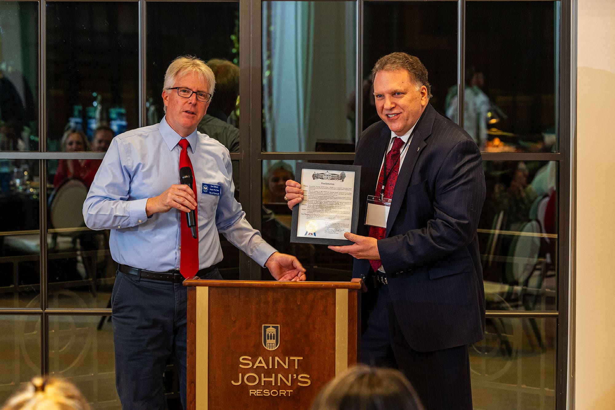 michigan-corporate-dj-awards-presentation Corporate event DJ providing microphone support during an awards presentation at a Michigan business event
