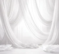 A Wind’s Whisper white draped photo booth backdrop